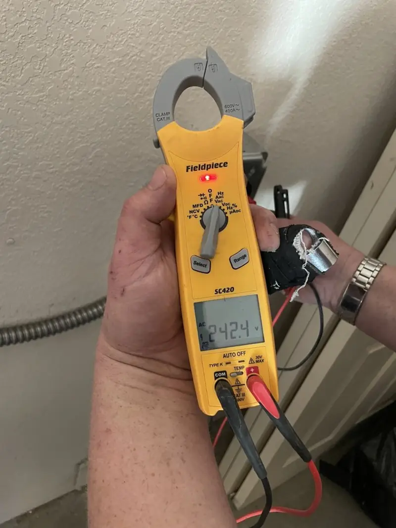 Voltage testing with clamp meter during Outlet Installation in Maryville